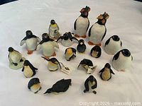 Group shot showing full lot of penguin figurines