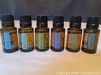 Front view of six labeled doTERRA 15 mL bottles