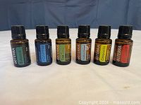 Front view of six labelled doTERRA bottles