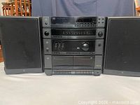 Front view of GE stereo system with two speakers