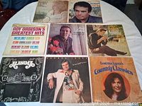 Front covers of eight LPs laid out on table