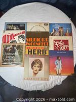 All eight LP records laid out showing front sleeves