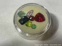 Top view of all seven gemstones in gem jar