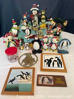 Entire collection laid out showing front row wall art, trivet, jar and multiple figurines