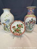 Group shot showing both vases, plate and stand