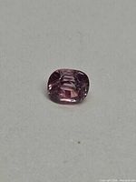 Cushion-cut spinel face-up view displaying colour and facets