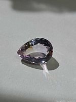 Pear-cut ametrine gemstone, three-quarter view