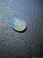 Top view of oval Ethiopian opal showing multicolor play-of-color