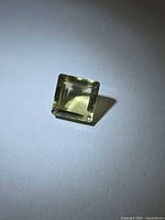 Top view of square-cut lemon citrine showing color and faceting