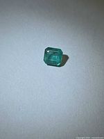 Loose emerald front view highlighting octagon cut