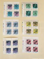 Overview of six stamp blocks showing all denominations and colours
