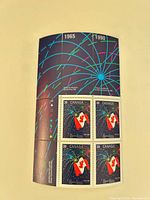 Full sheetlet showing four stamps and upper selvage with fireworks graphic