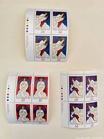 Group shot of three Canada Post Christmas Angel plate blocks showing 34¢, 39¢, 68¢ denominations