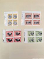 Overview of four Canada Post mint stamp blocks