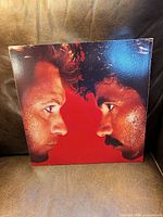 Front cover artwork with both artists in profile