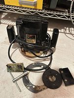 Router with cord and accessory plates spread out