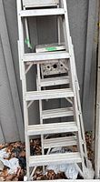 Full view of the aluminum ladder showing steps and frame