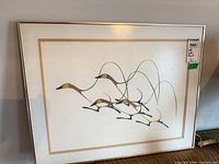 Full view of framed Benjamin Chee Chee print in metal frame with mat