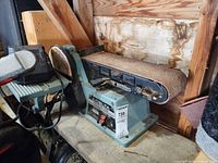 Overall view of Delta combination belt/disc sander on workbench