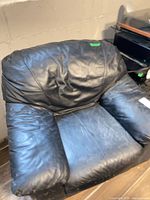 Front view of black leather armchair