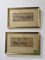 Both framed watercolours hanging on wall