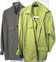 Front view of both jackets on hangers