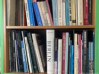 Upper and lower shelves filled with art history books