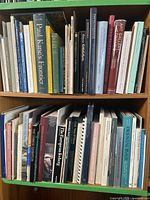 Two shelves filled edge-to-edge with art history and Canadian art books