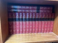 First shelf showing front row and additional stacked volumes of Harvard Classics