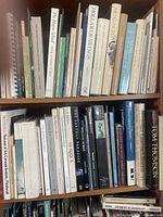 Two shelves of assorted art books showing spines and titles