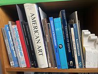 First shelf showing American Art, Illuminations and other titles