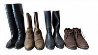 All four pairs of boots lined up showing styles, colors and wear