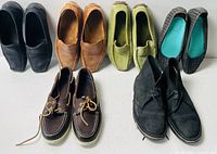 Six pairs assorted women’s shoes arranged in two rows