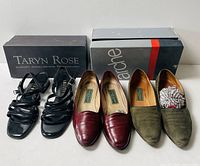 Three pairs of women’s shoes with two non-matching boxes