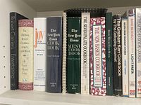 First shelf showing classic cookbooks including Joy of Cooking, New York Times titles and Silver Palate series