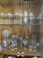 Full view of both shelves showing assorted glassware pieces