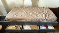 Full view of the day bed with mattress on top and drawers open