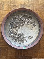 Top view showing full bowl, relief interior, rim and scale