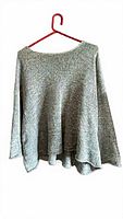 Front view of blue-grey marled cotton sweater on hanger