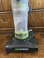 Front close-up of Eureka Airspeed vacuum base and dust canister