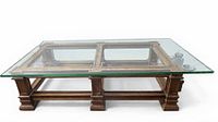 Full view of rectangular wood base coffee table with glass top