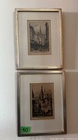 Front view showing both framed etchings hung vertically