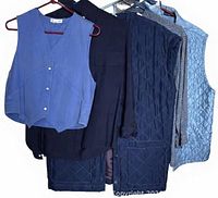 Group shot of all five garments on hangers
