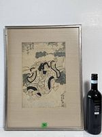 Front view of framed print beside wine bottle for scale