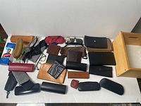 Group shot of all reading glasses, cases, wallets