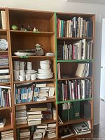 Front view showing both wooden bookcases with shelves