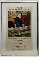 Framed exhibition poster with visible text and artwork