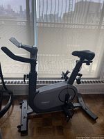 Side view of Renpho stationary bike showing overall design