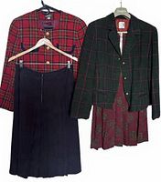 Front view of both plaid blazers and coordinating pleated skirts