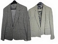Front view of both blazers on hangers